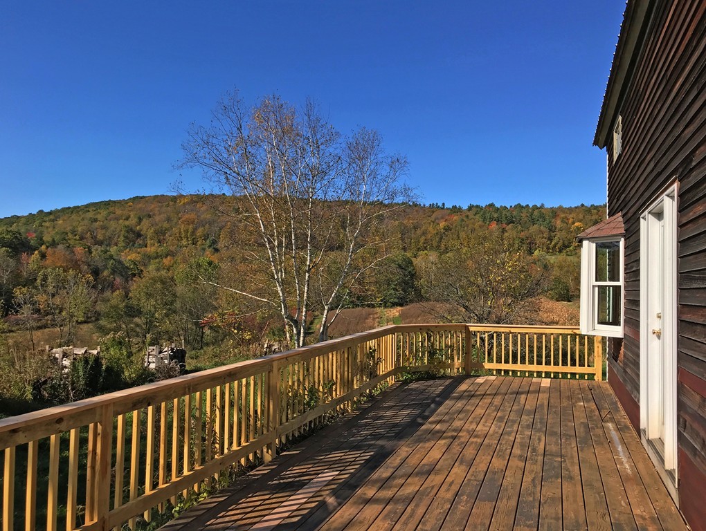 108 West Leyden Road Colrain, MA 01340 - Photo 5 of 30 a view of a balcony with wooden floor and fence