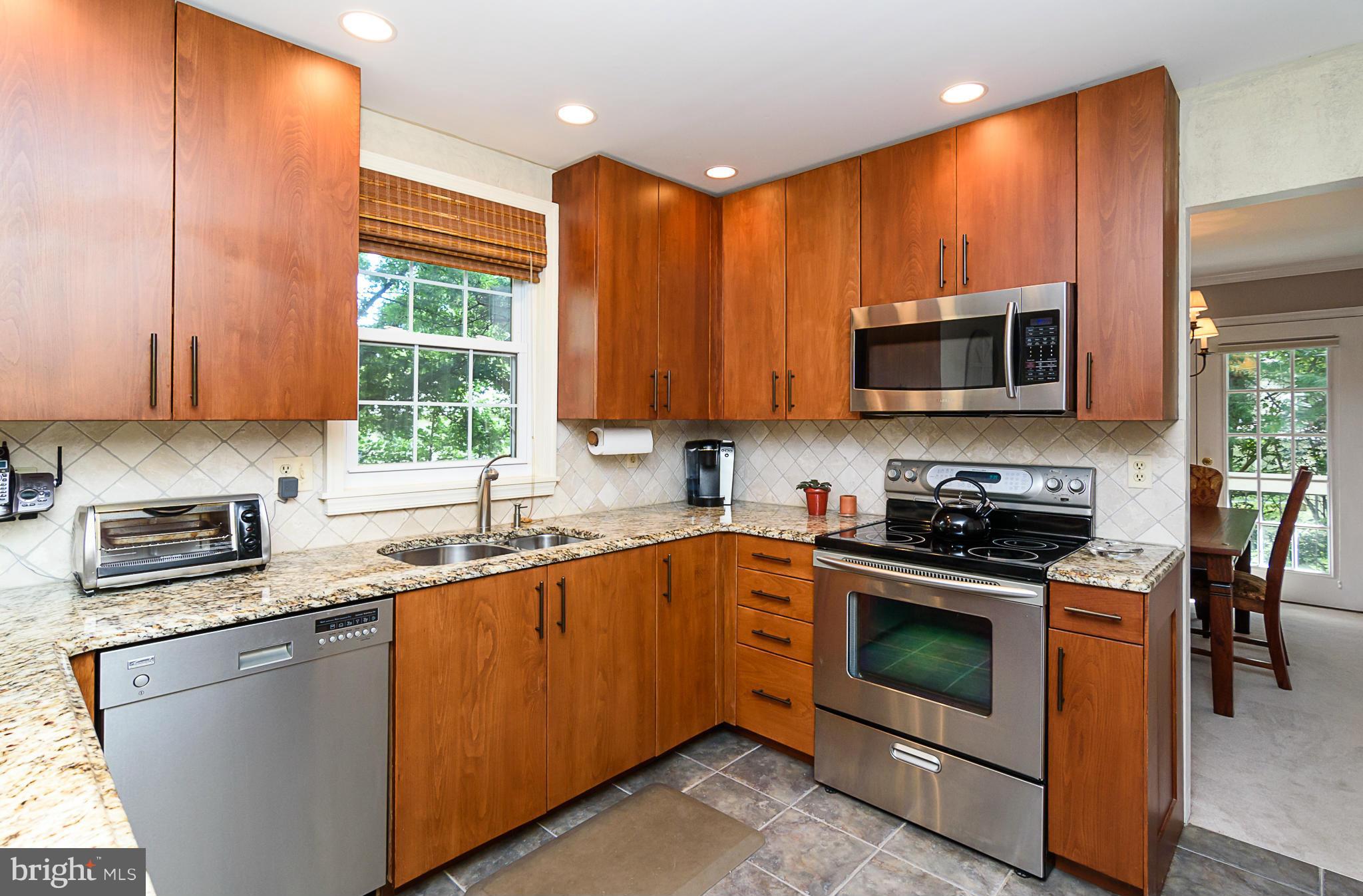 7355 Kindler Road Columbia, MD 21046 - Photo 2 of 30 Stainless steel appliances and tile backsplash