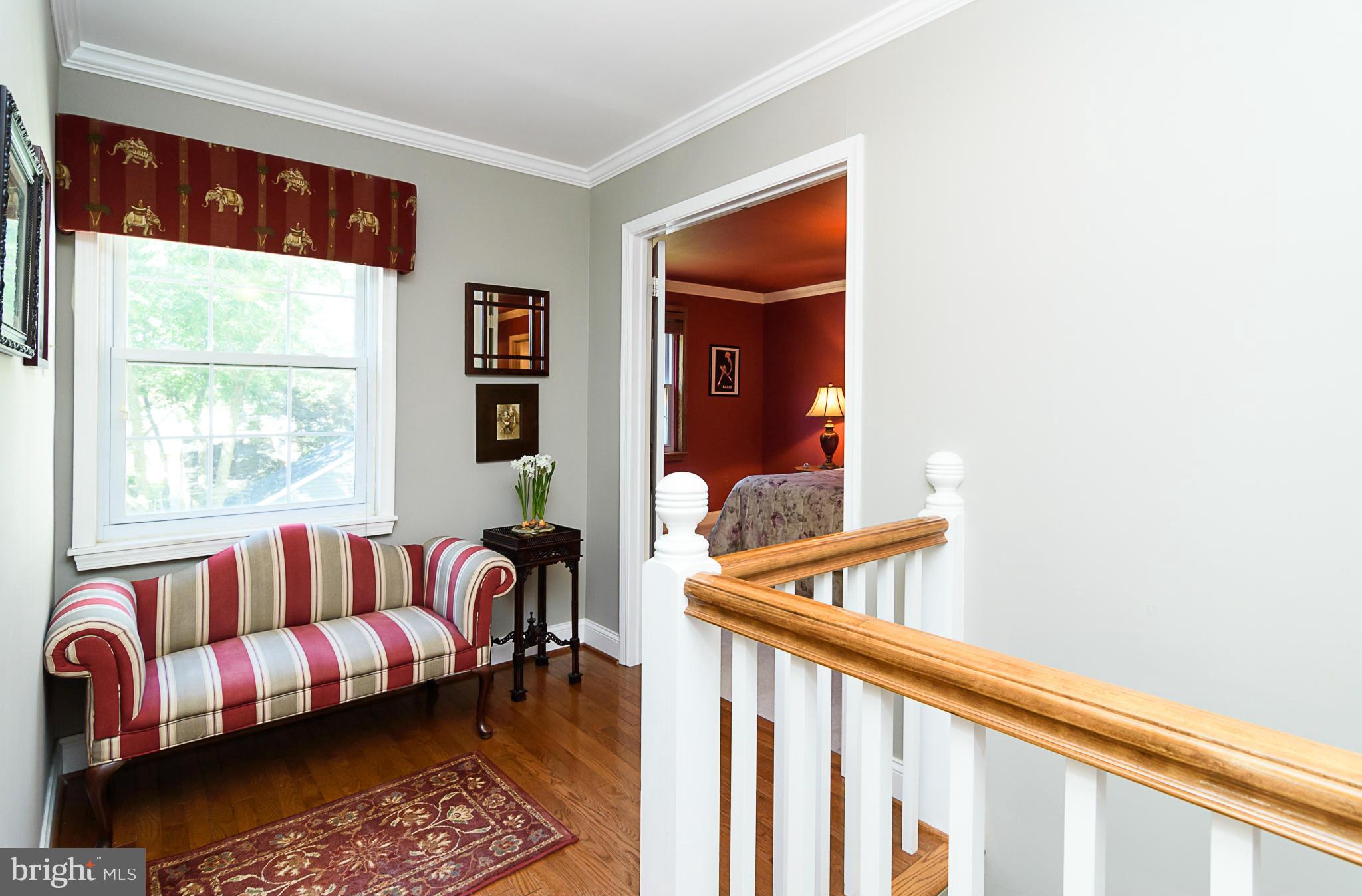7355 Kindler Road Columbia, MD 21046 - Photo 15 of 30 Upper level hallway with gleaming hardwood floors