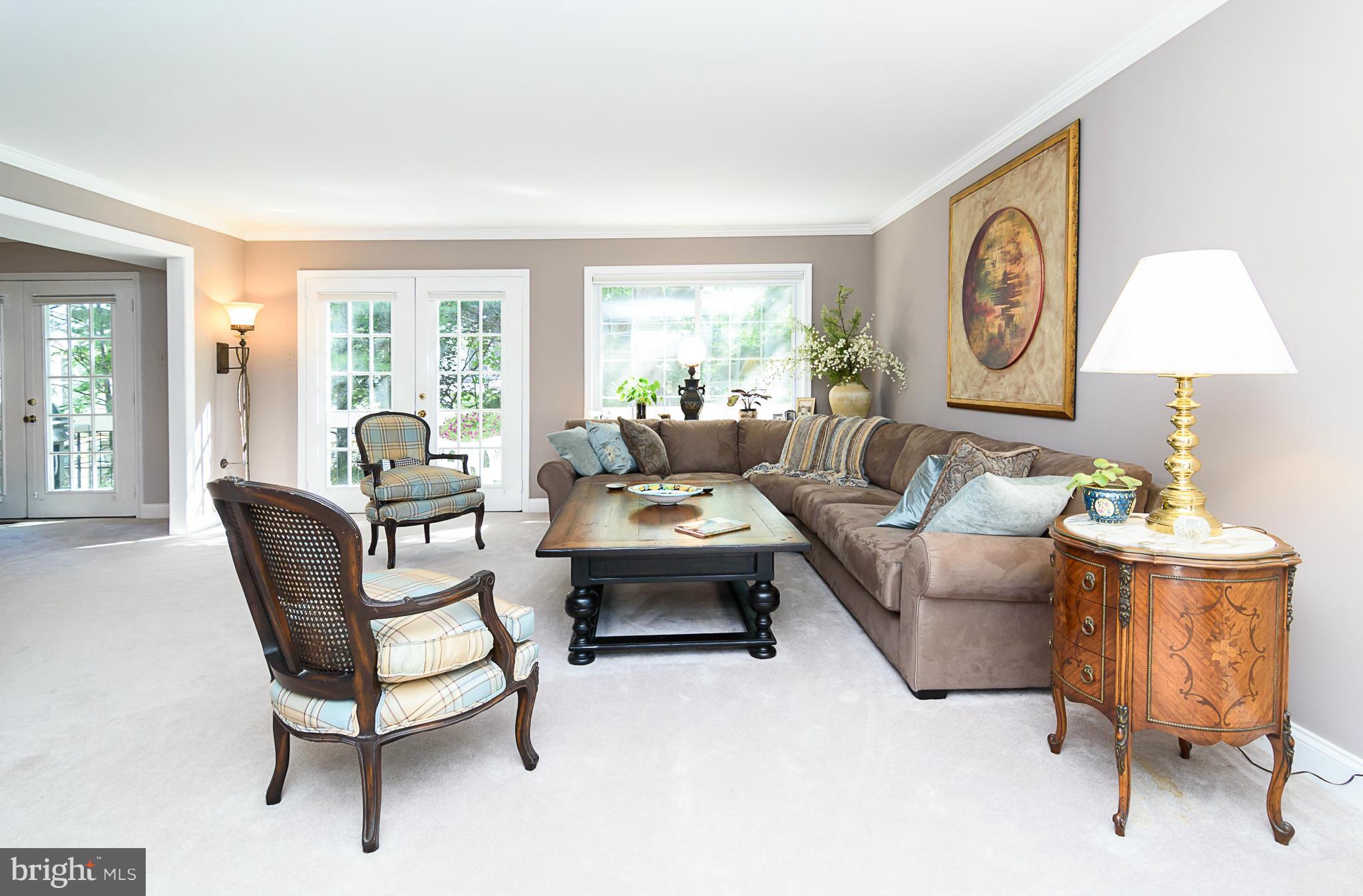 7355 Kindler Road Columbia, MD 21046 - Photo 8 of 30 Spacious living room with French doors to deck