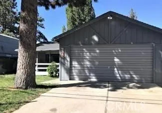a side view of a house with a yard