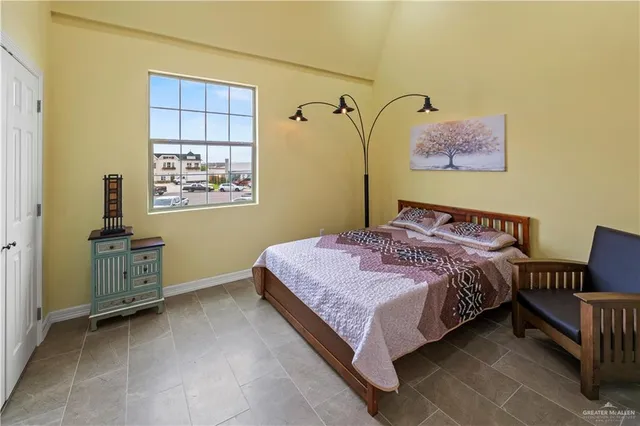 a bedroom with a bed and a table