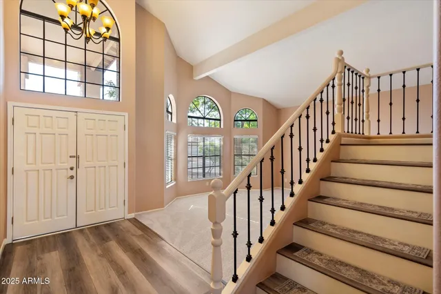 a open kitchen with stainless steel appliances granite countertop a stove and a refrigerator