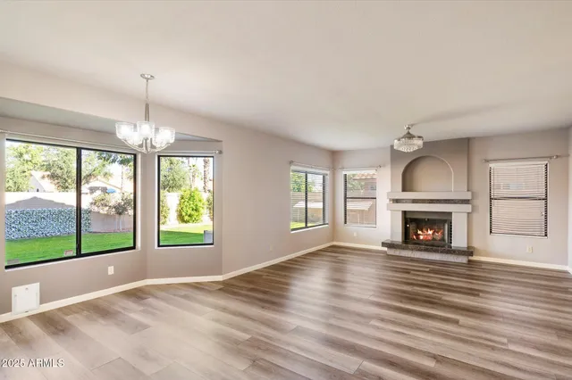 a bathroom with a granite countertop sink mirror and bathtub