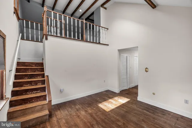 a view of entryway with wooden floor