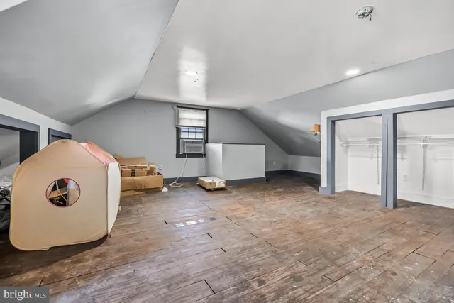 a view of a livingroom with a chair and table