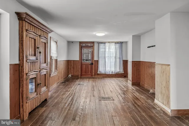 a view of entryway with wooden floor