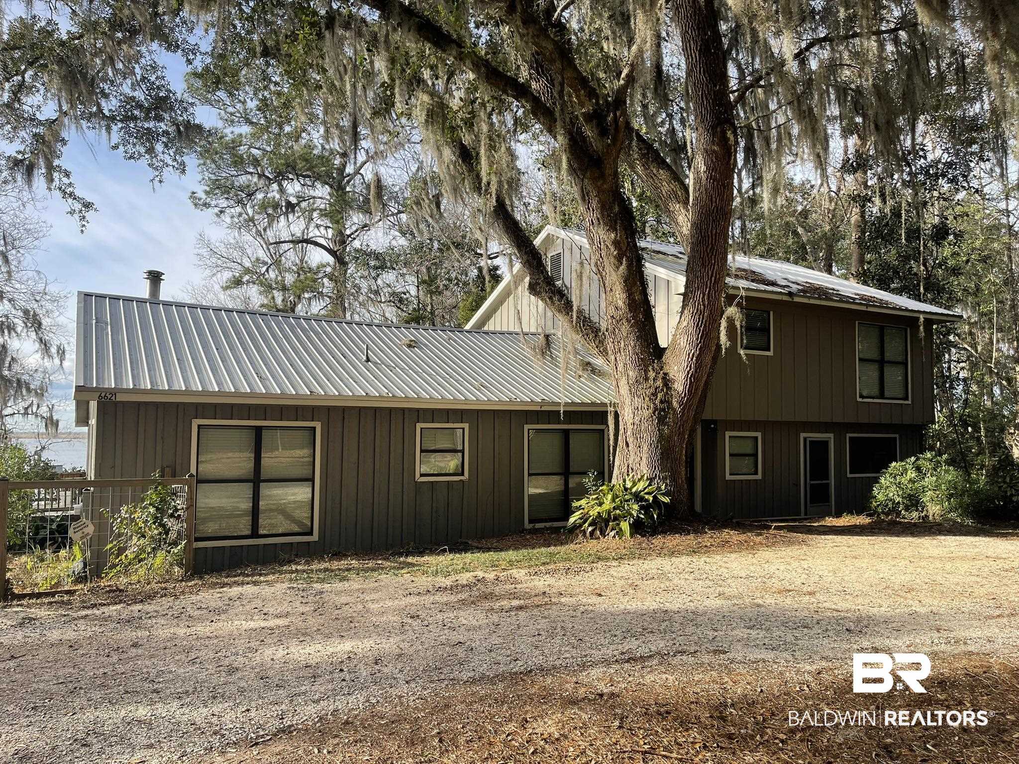 6621 Purvis Road Daphne, AL 36527 - Photo 1 of 59 Rear view of house with a metal roof