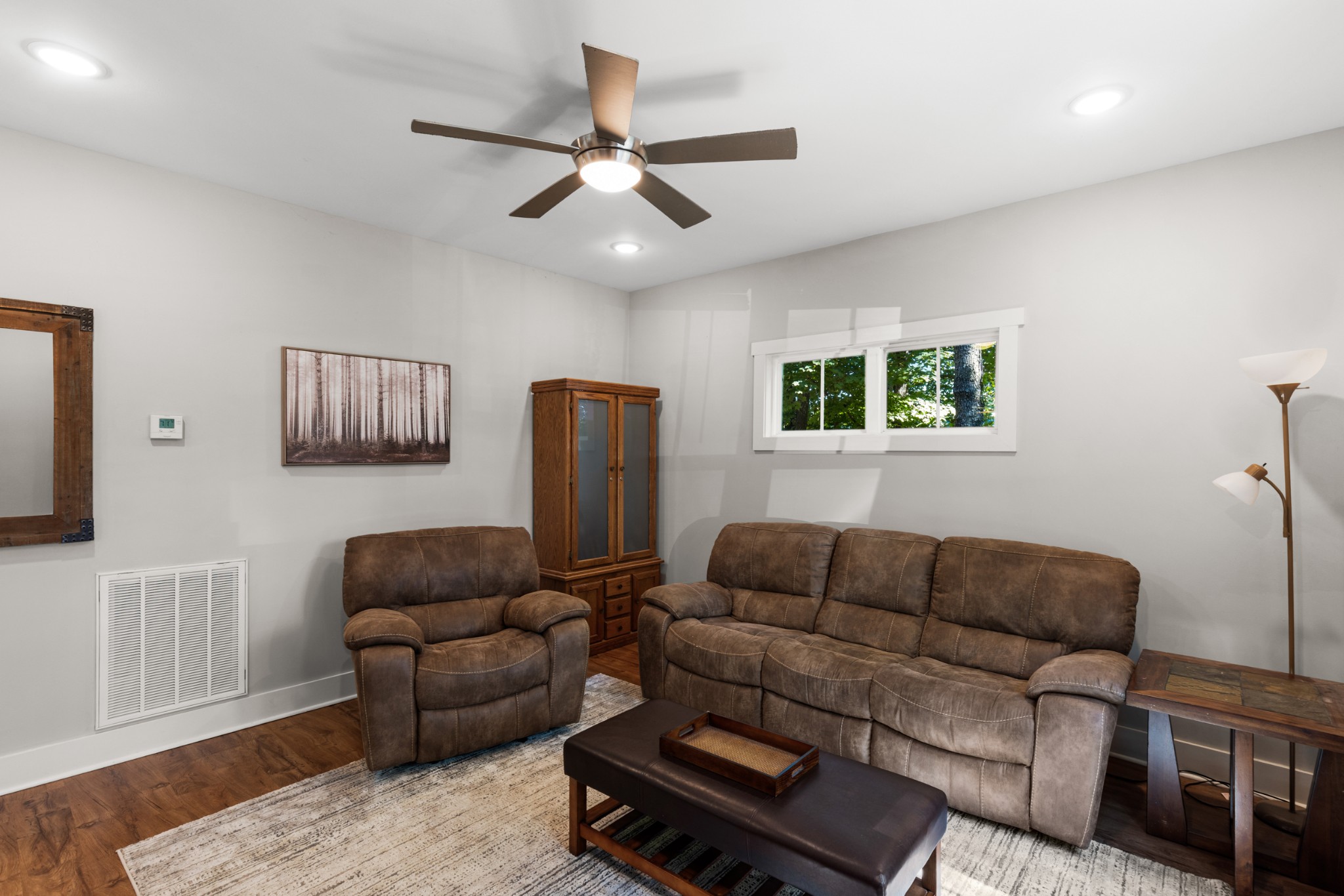 115 North Adams Street Adams, TN 37010 - Photo 9 of 44 a living room with furniture a ceiling fan and a window