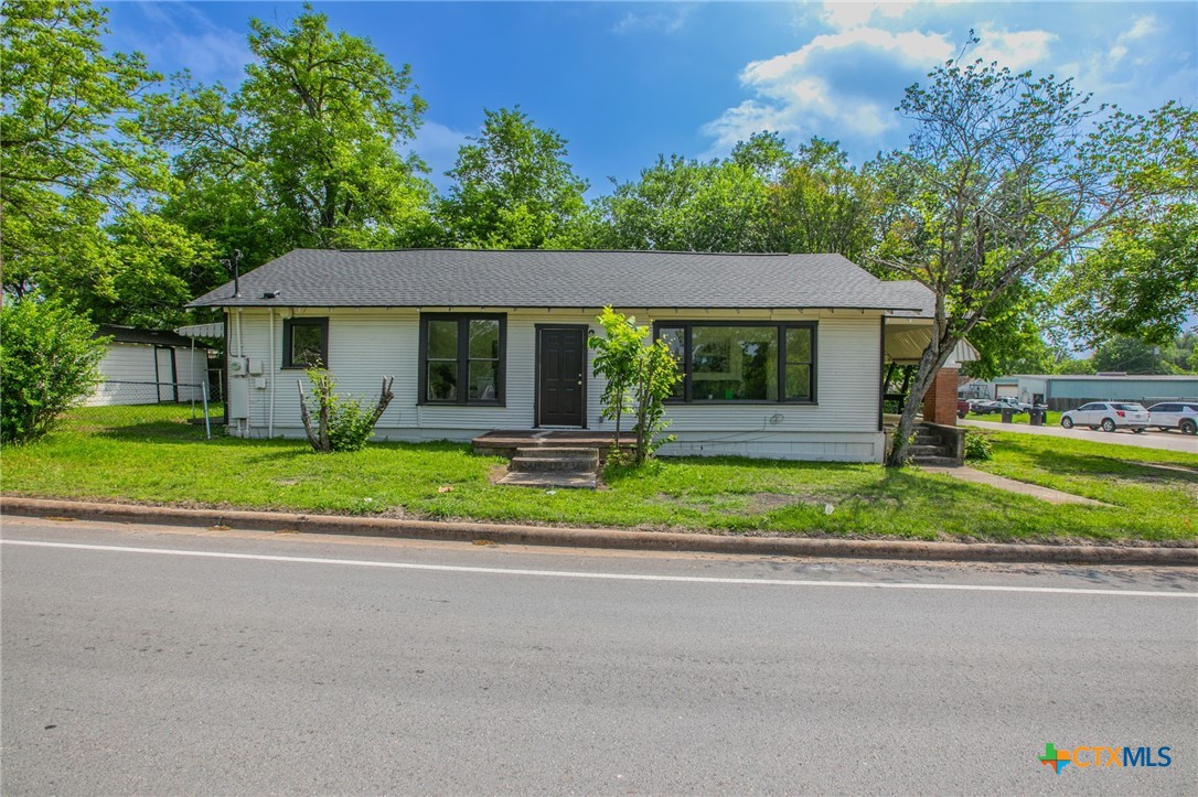1303 South 15th Street Temple, TX 76504 - Photo 1 of 19 a front view of a house with a yard