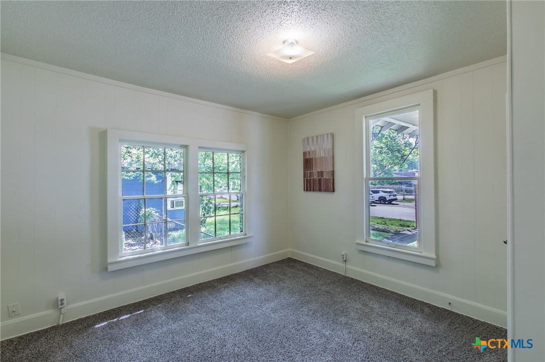1303 South 15th Street Temple, TX 76504 - Photo 13 of 19 an empty room with windows