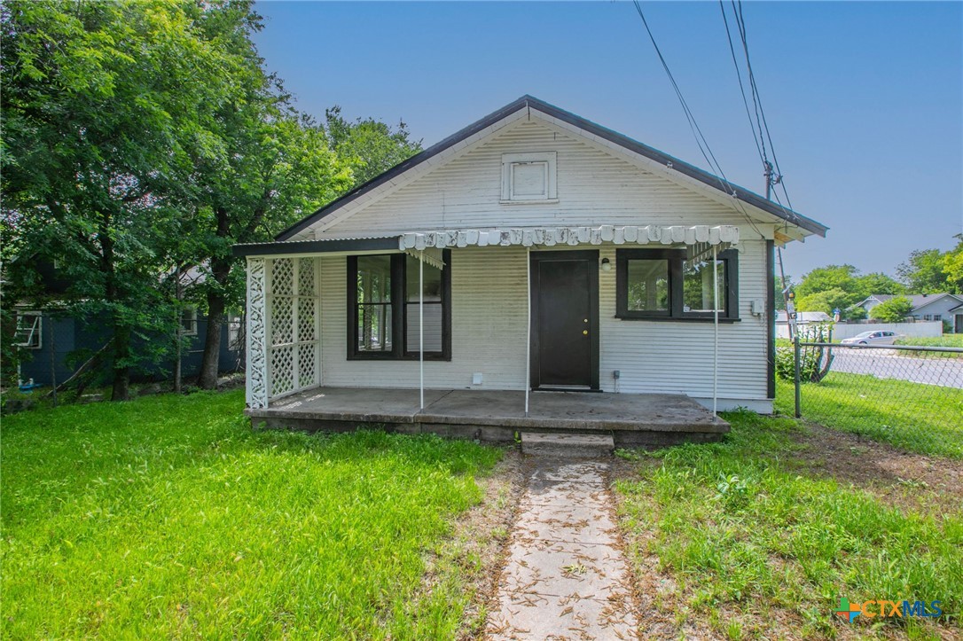 1303 South 15th Street Temple, TX 76504 - Photo 17 of 19 a front view of a house with a yard