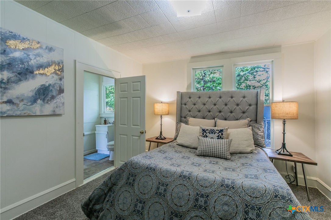 1303 South 15th Street Temple, TX 76504 - Photo 10 of 19 a bedroom with a bed and window