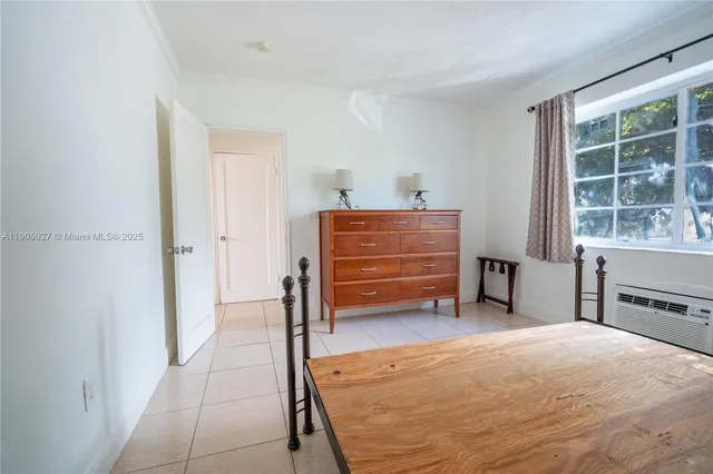 a room with a bed and a window