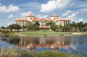 a front view of a lake with a building in the background