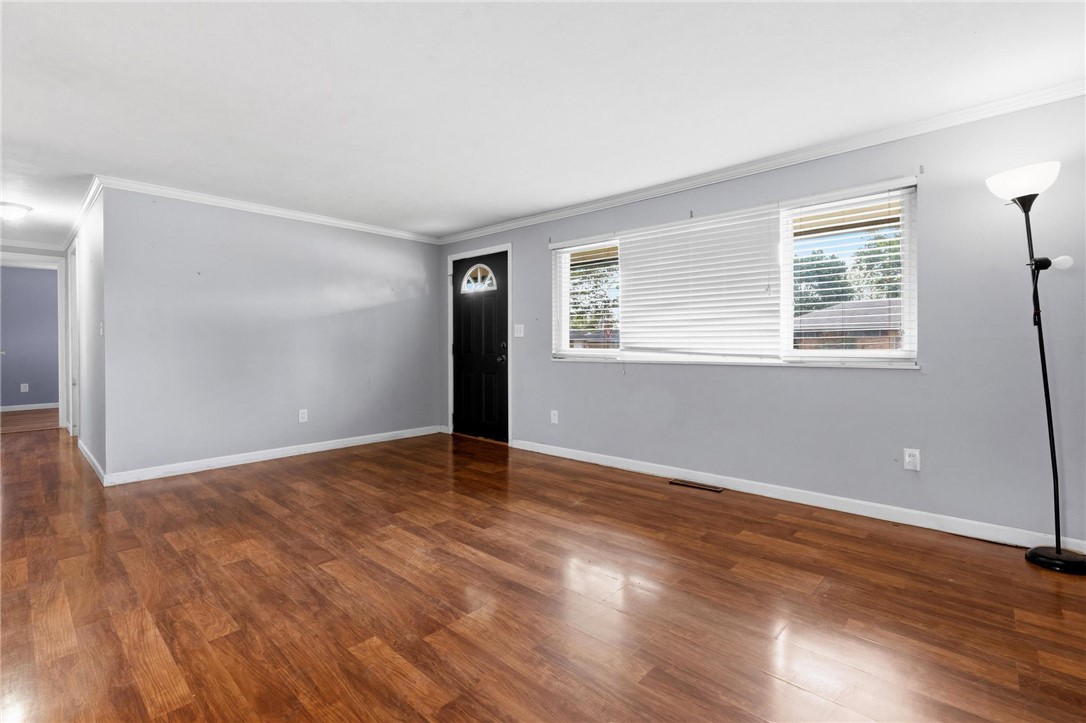 3890 Endover Road Dayton, OH 45439 - Photo 12 of 26 This inviting living space features gleaming hardwood floors and ample natural light, creating a bright and airy ambiance.