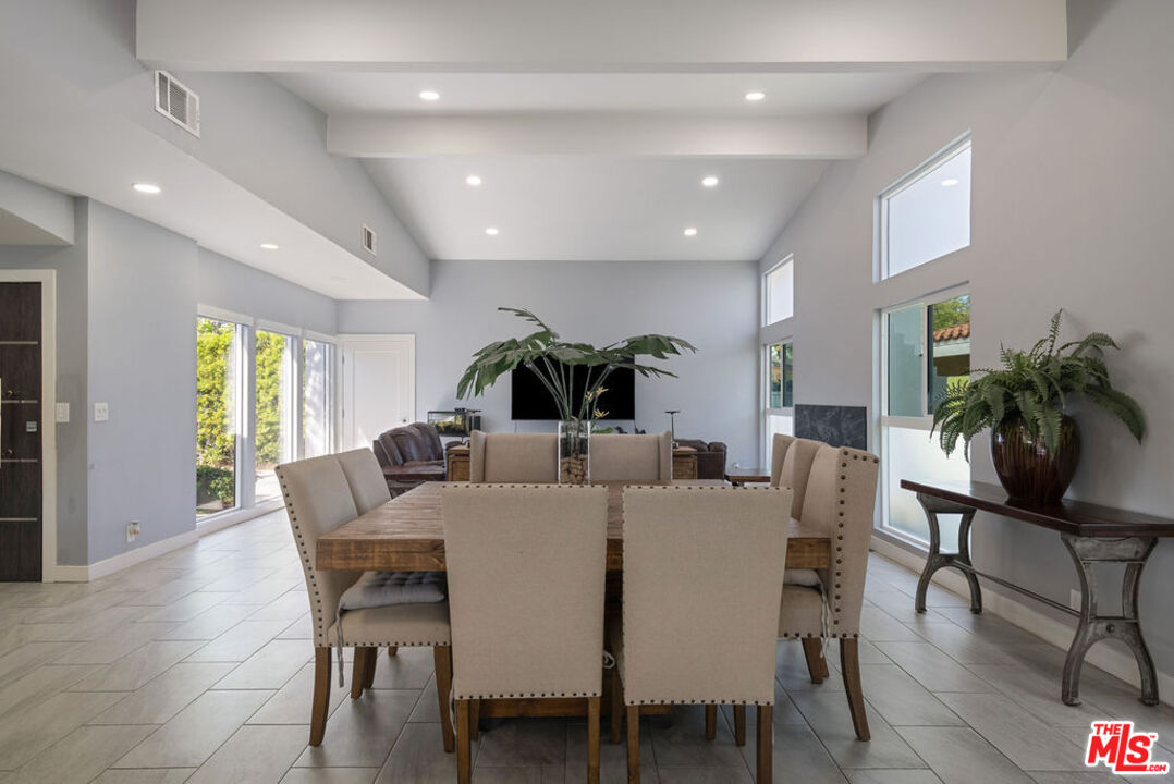 11332 Loch Lomond Road Los Alamitos, CA 90720 - Photo 17 of 55 a view of a dining room with furniture window and wooden floor