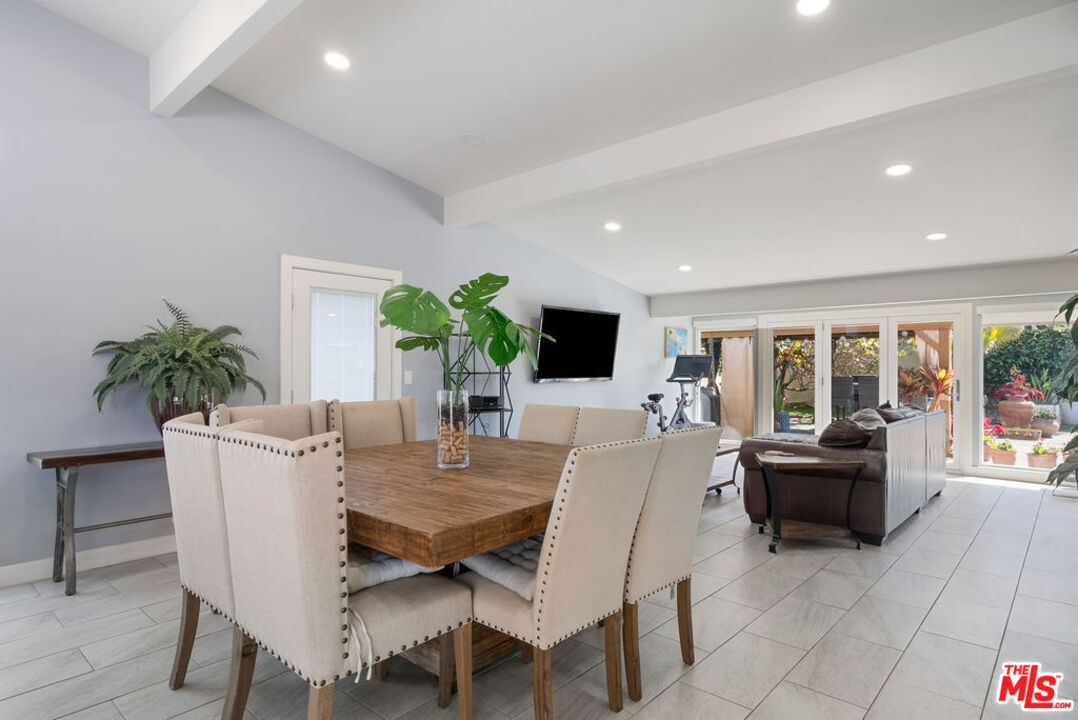 11332 Loch Lomond Road Los Alamitos, CA 90720 - Photo 18 of 55 a view of a dining room with furniture and a potted plant