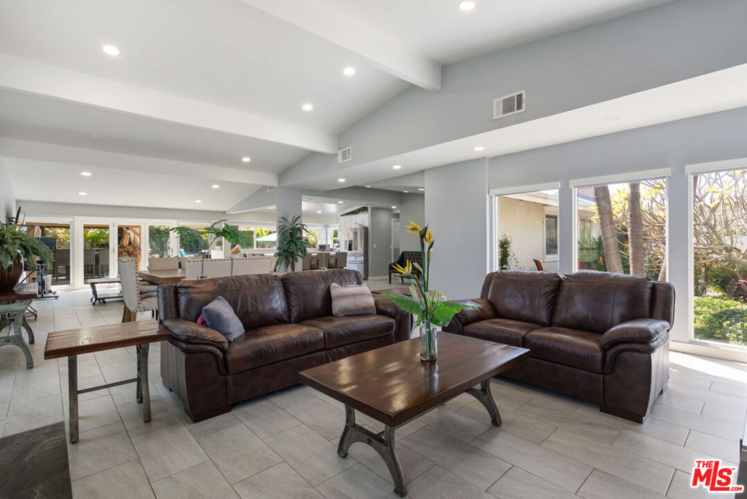11332 Loch Lomond Road Los Alamitos, CA 90720 - Photo 24 of 55 a living room with furniture and a large window