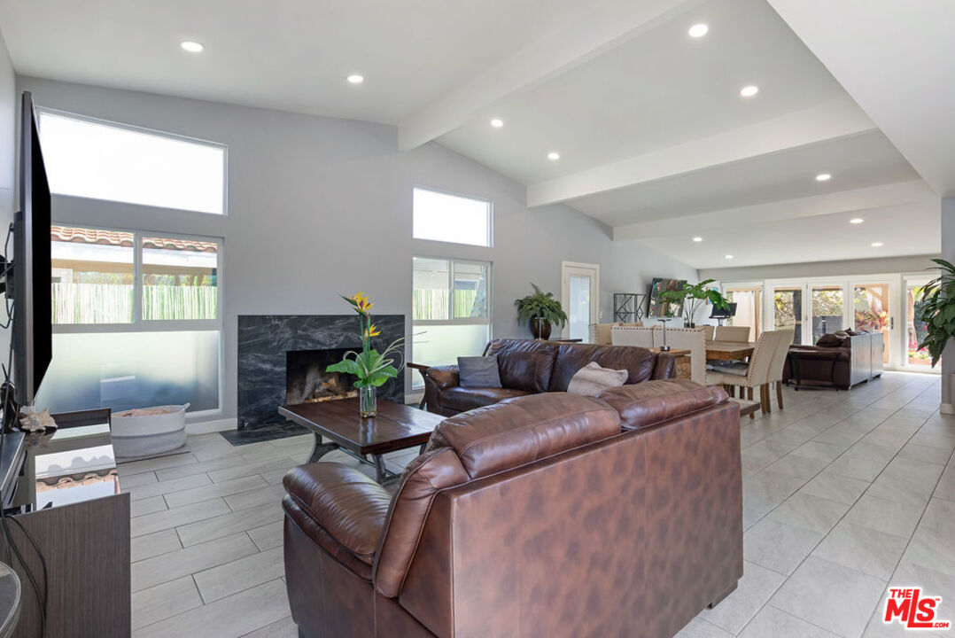 11332 Loch Lomond Road Los Alamitos, CA 90720 - Photo 25 of 55 a living room with furniture and a fireplace