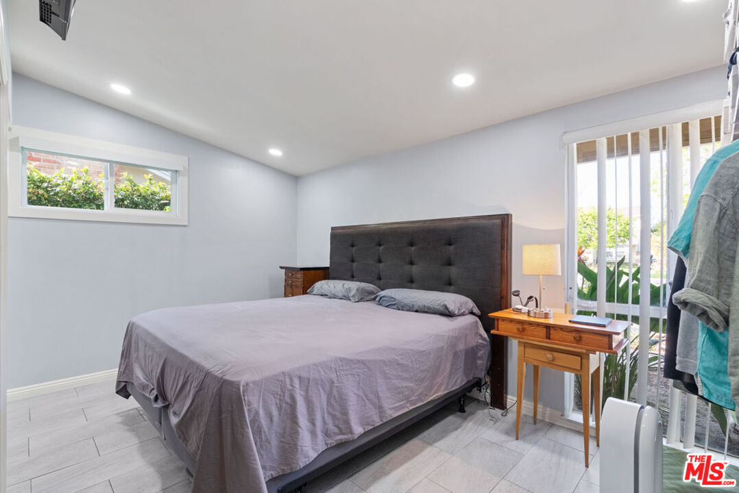 11332 Loch Lomond Road Los Alamitos, CA 90720 - Photo 30 of 55 a bedroom with a bed and a window