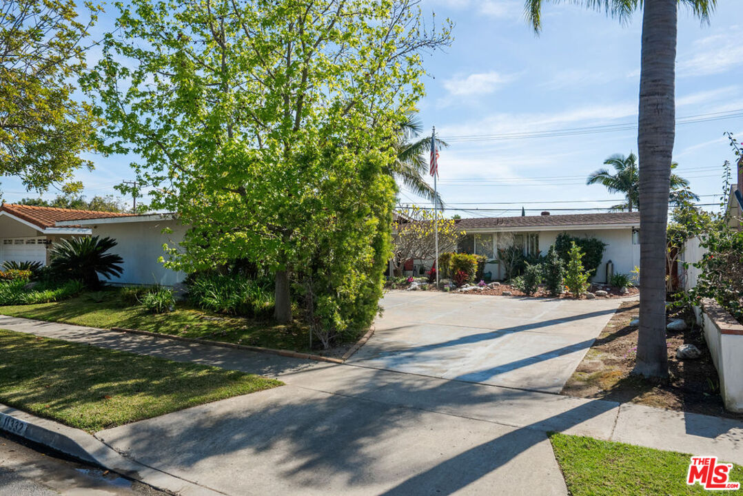 11332 Loch Lomond Road Los Alamitos, CA 90720 - Photo 3 of 55 a view of a yard and front view of a house