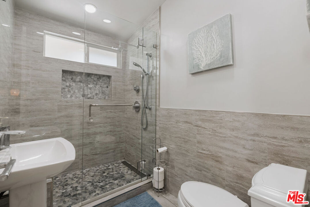 11332 Loch Lomond Road Los Alamitos, CA 90720 - Photo 34 of 55 a bathroom with a toilet sink and shower