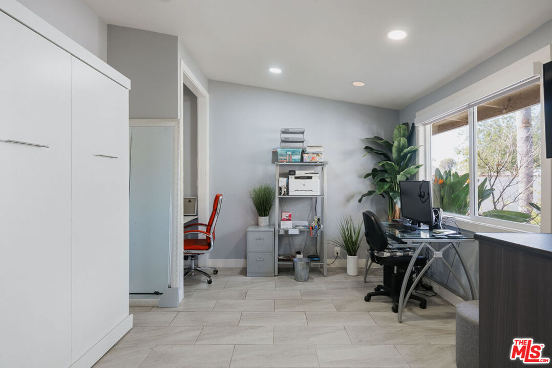 11332 Loch Lomond Road Los Alamitos, CA 90720 - Photo 35 of 55 a view of a room with gym equipment