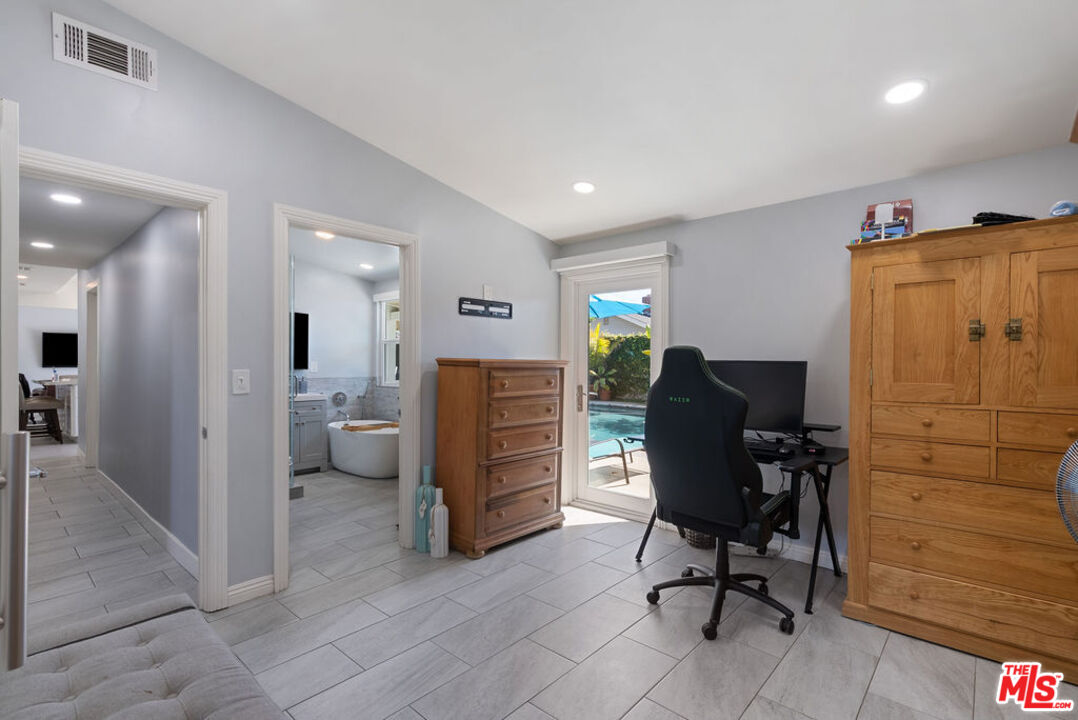 11332 Loch Lomond Road Los Alamitos, CA 90720 - Photo 36 of 55 a view of a workspace with furniture and a window