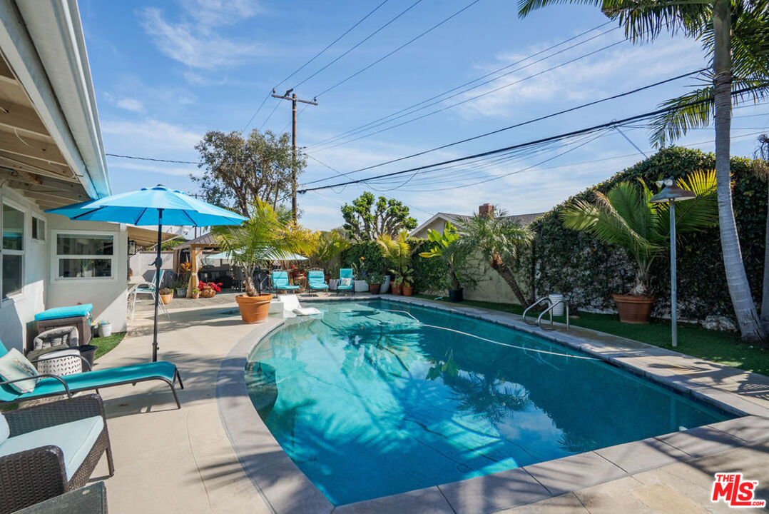 11332 Loch Lomond Road Los Alamitos, CA 90720 - Photo 49 of 55 a view of a swimming pool with a patio