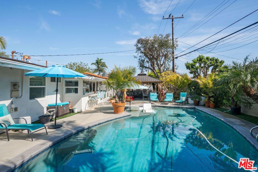 11332 Loch Lomond Road Los Alamitos, CA 90720 - Photo 50 of 55 a view of a house with backyard porch and patio