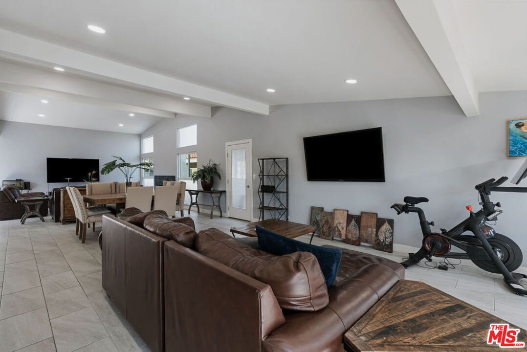 11332 Loch Lomond Road Los Alamitos, CA 90720 - Photo 9 of 55 a living room with furniture and a flat screen tv
