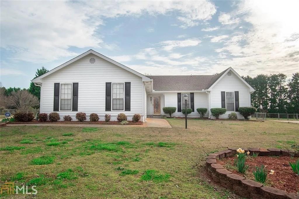 11058 Hunters Lane Hampton, GA 30228 - Photo 12 of 25 a view of a house with backyard and trees