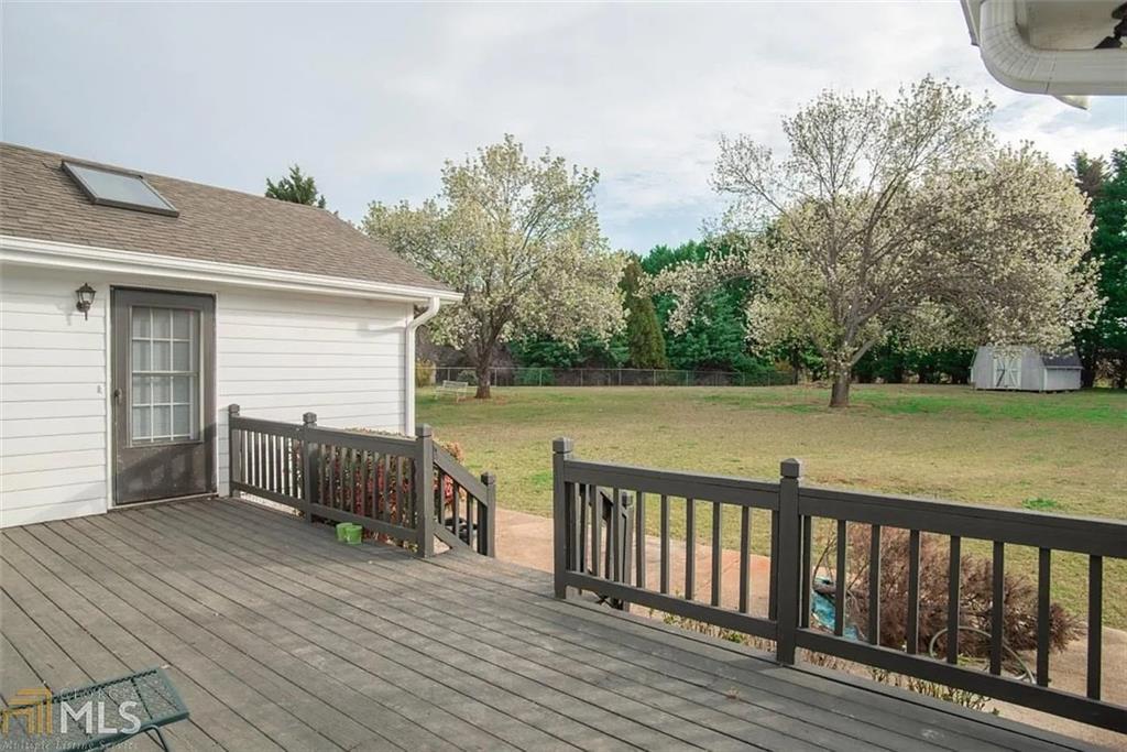 11058 Hunters Lane Hampton, GA 30228 - Photo 17 of 25 a view of deck with hardwood and lake view