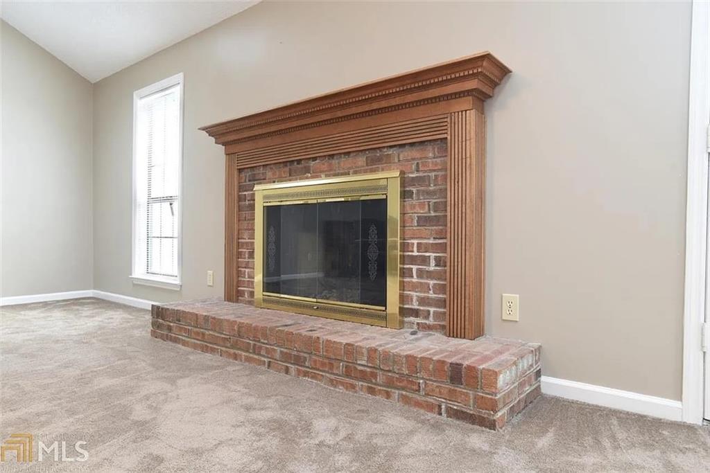 11058 Hunters Lane Hampton, GA 30228 - Photo 20 of 25 a view of fireplace and window
