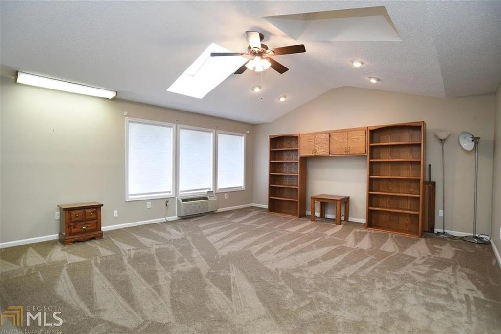 11058 Hunters Lane Hampton, GA 30228 - Photo 24 of 25 wooden floor in an empty room with a window