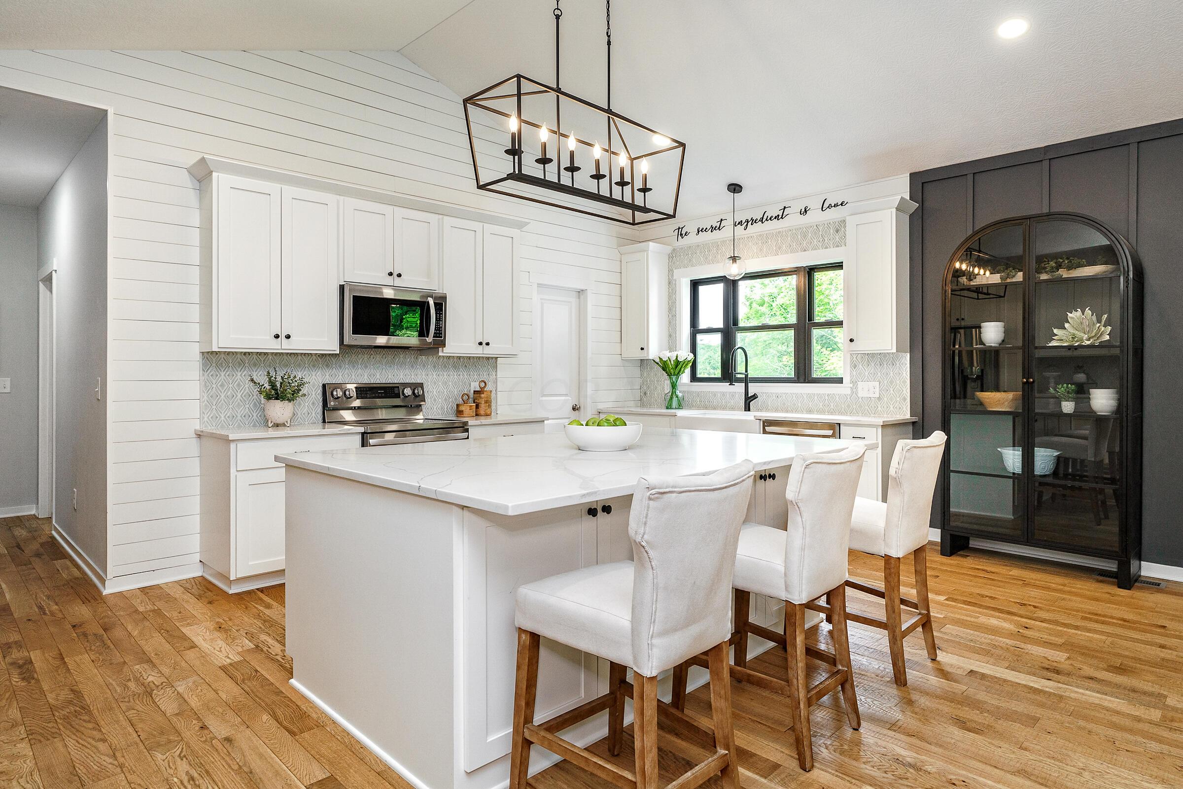 701 Ross Road Sunbury, OH 43074 - Photo 13 of 74 Premium gourmet kitchen with large quartz island with bar seating and attention to every detail