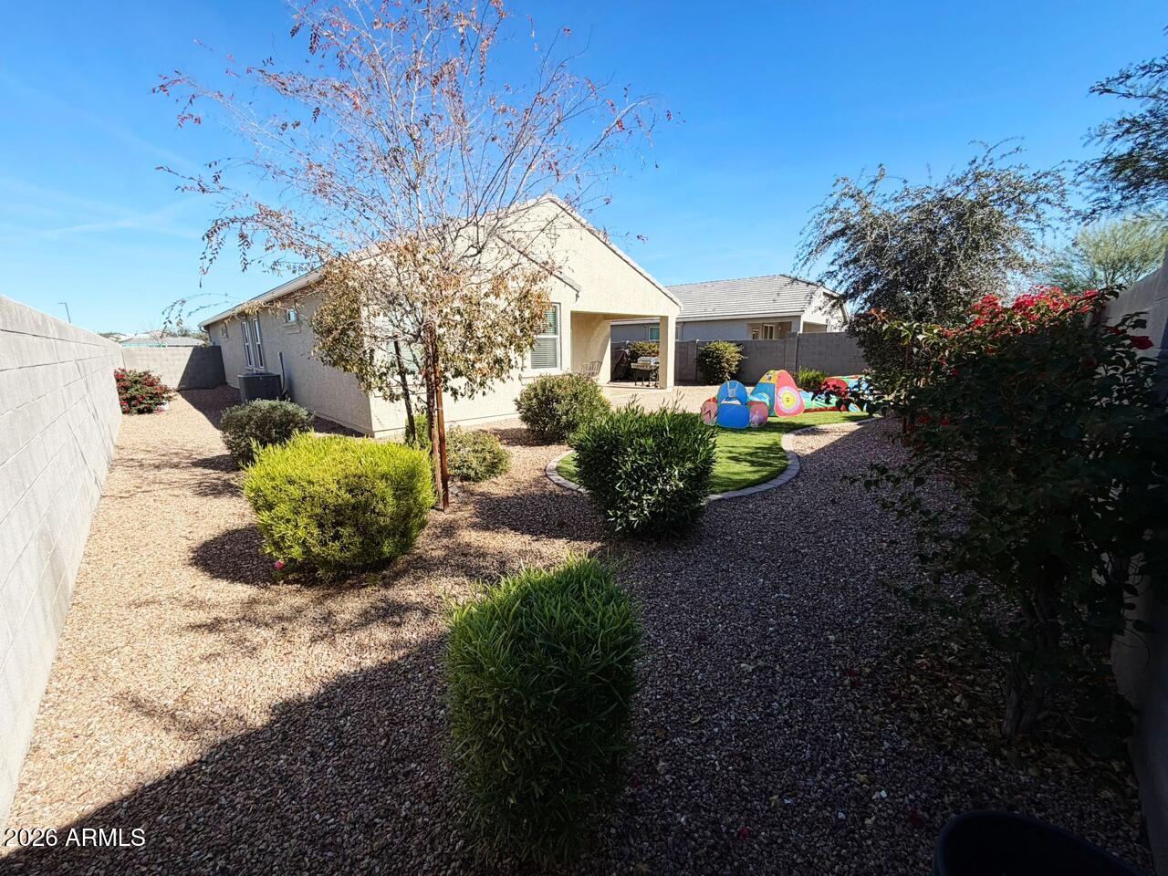 7851 West Riverside Avenue Phoenix, AZ 85043 - Photo 27 of 40 a view of a house with backyard and garden