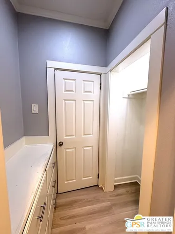 a view of a kitchen cabinets and wooden floor