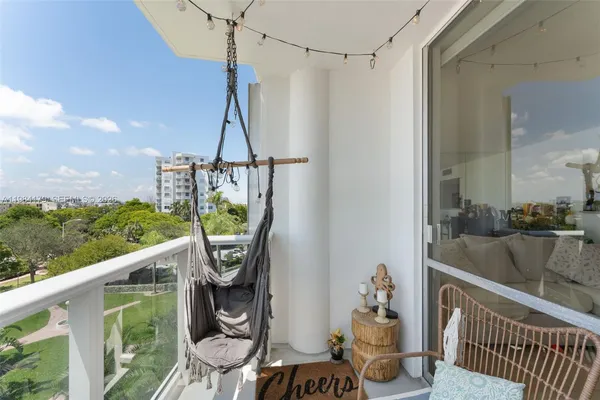 a view of a balcony with chairs