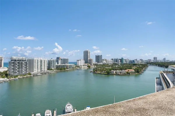 a view of a lake with tall building