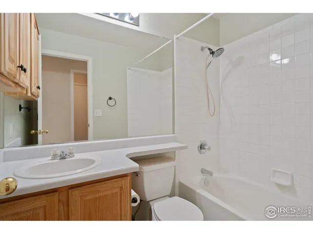 a bathroom with a sink a mirror and a bathtub