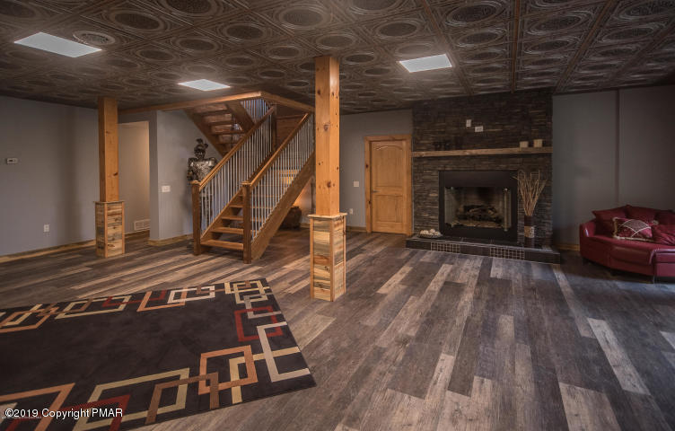 101 Indian Spring Road Tunkhannock, PA 18657 - Photo 31 of 47 lower level stone floor to ceiling firep