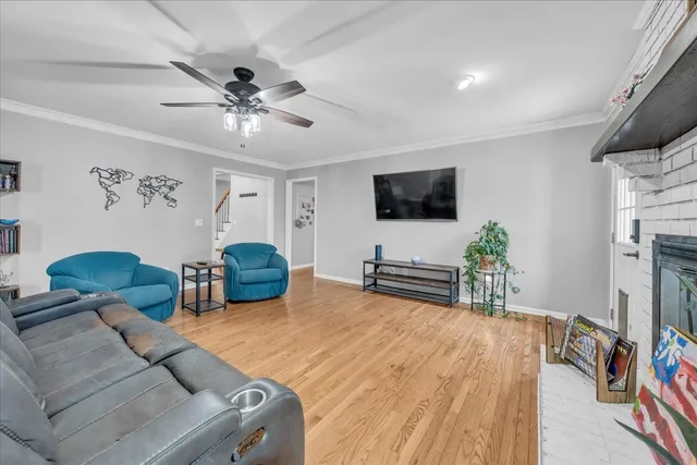 a bedroom with furniture and a flat screen tv