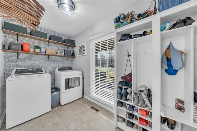 a bedroom with a bed a dresser and a window