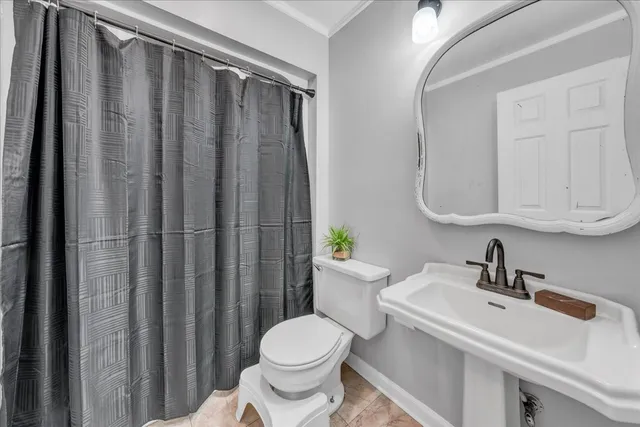 a bathroom with double sink and a mirror