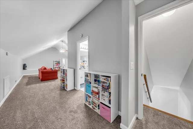 a bedroom with furniture and a flat screen tv