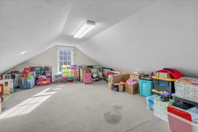 a bedroom with a bed and ceiling fan