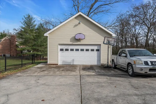 a view of a house with a yard and garage