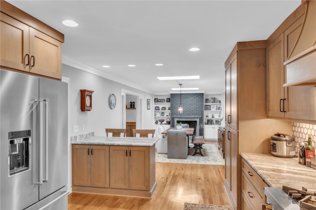 400 Arcadia Drive Anderson, SC 29621 - Photo 11 of 43 This bright kitchen with a fireplace offers a welcoming space for cooking and gatherings.